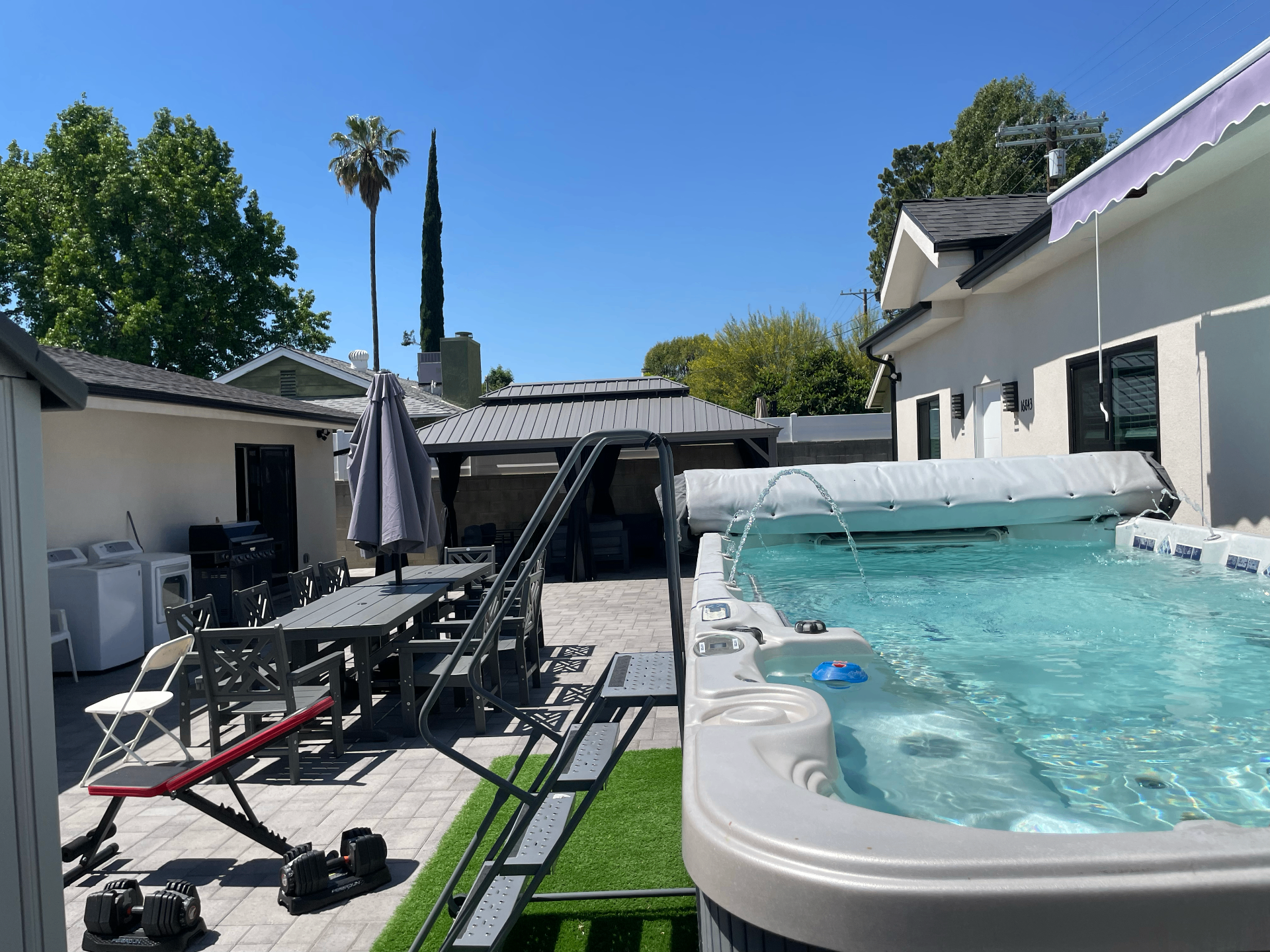 Outdoor patio and cabana at the Freedom Recovery residence — calm, residential, daylight